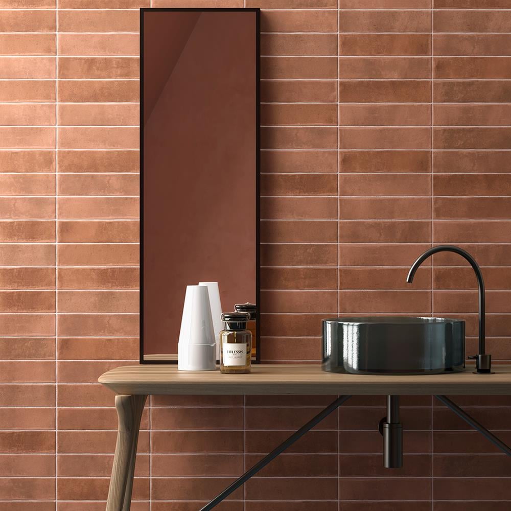 Stacked terracotta metro tiles in a modern bathroom